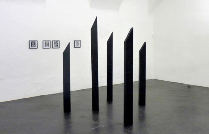 Untitled (5 Oblique Angled Columns Made Out of Tar), 2014, Tar, dimensions variable